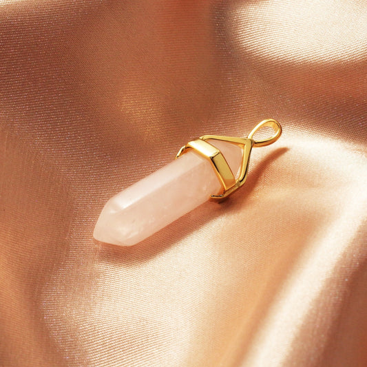 Chainstones Rose Quartz necklace showing soft pink color, natural-looking translucency and elongated crystal point shape